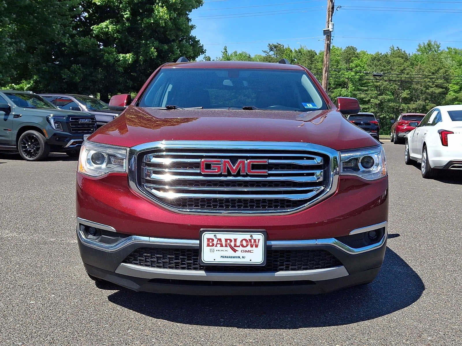 2018 GMC Acadia SLE in Crimson Red Tintcoat — front three-quarter view