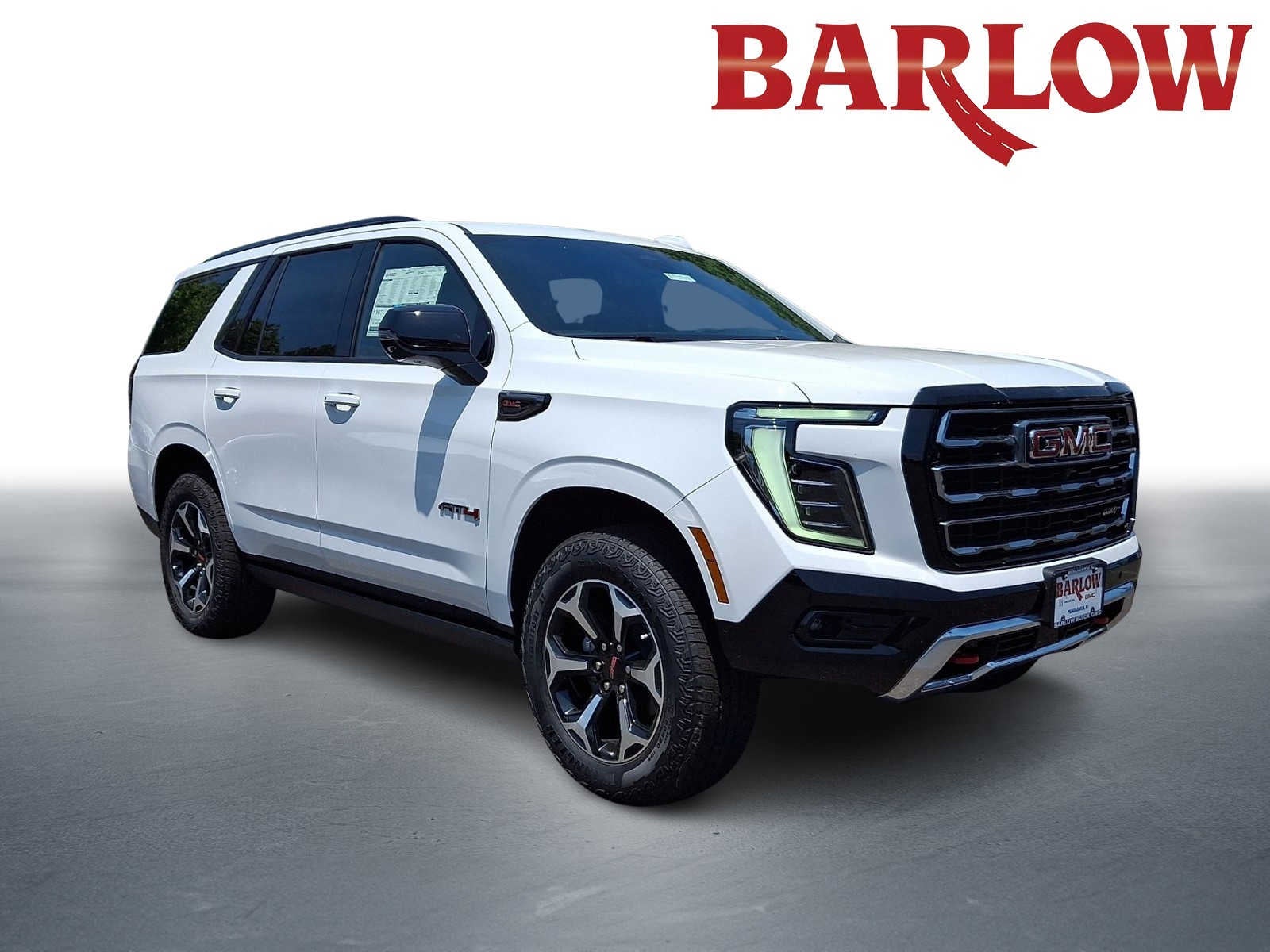 2026 GMC Yukon AT4 in Summit White — front three-quarter view
