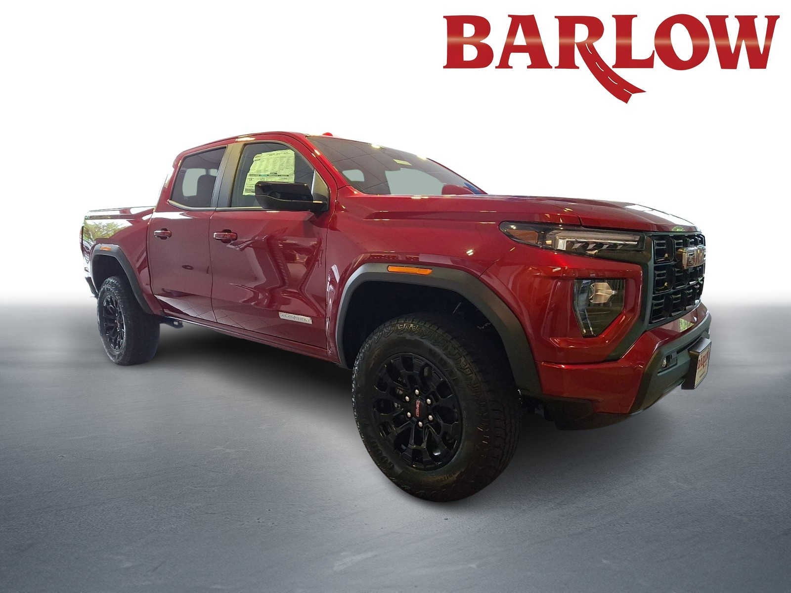 2026 GMC Canyon Elevation in Volcanic Red Tintcoat — front three-quarter view