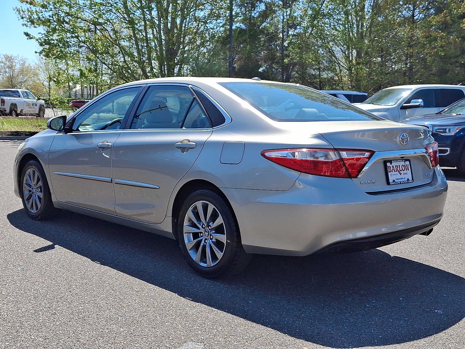 2016 Toyota Camry — rear three-quarter view