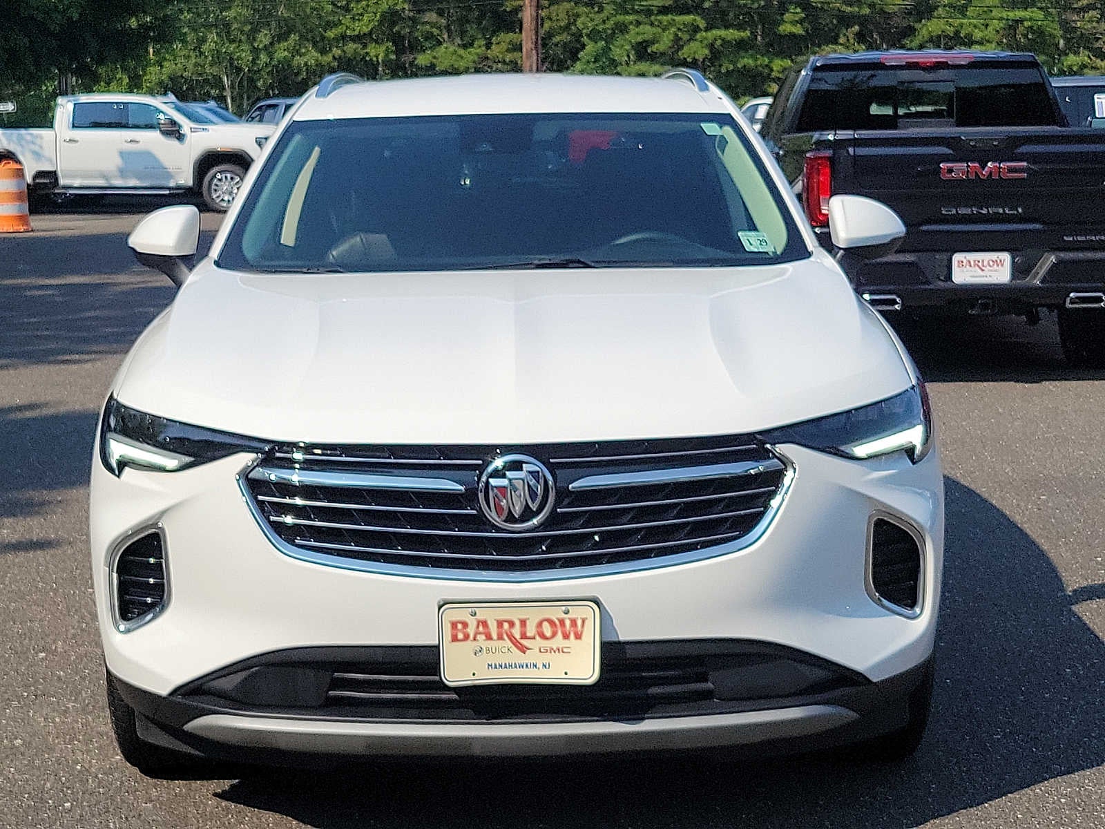 2023 Buick Envision Essence in Summit White — front three-quarter view